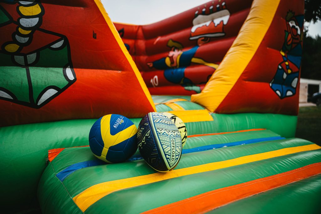 huge colourful bouncy castle with balls on